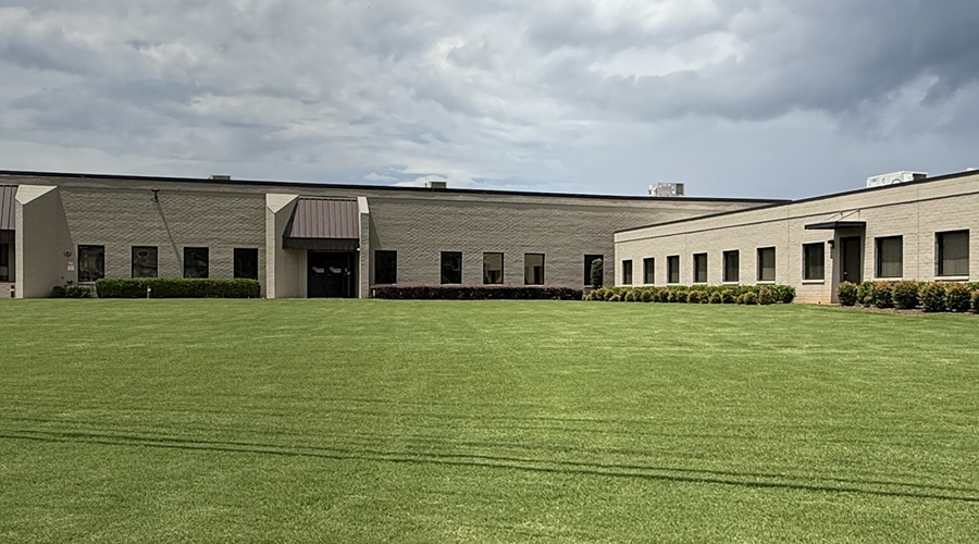 Building in front of green grass