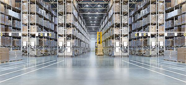 Fork lift between rows of warehouse racks
