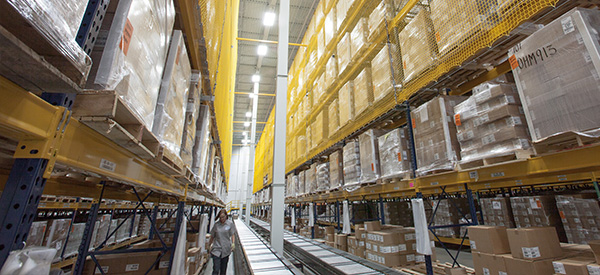 Warehouse shelves filled with boxes and pallets