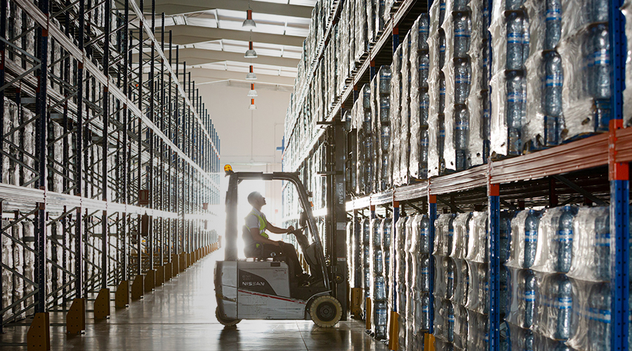 Man in forklift in warehouse