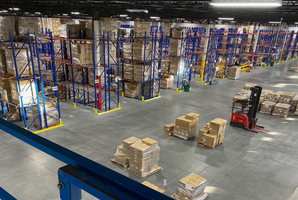 Warehouse shelving with forklift