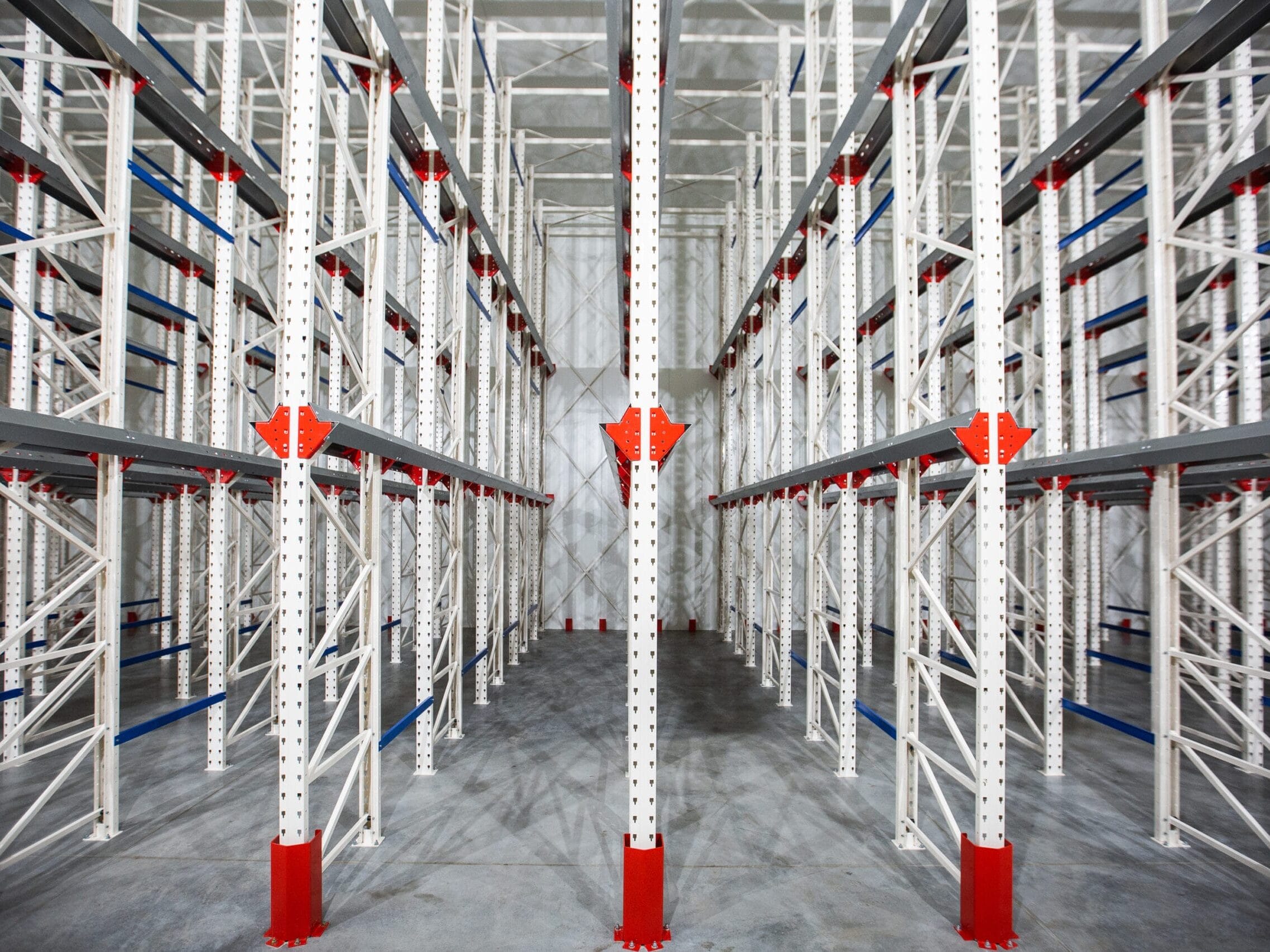 warehouse cantilever racking systems for storage aluminum pipe or profiles. pallet rack and industrial warehouse racking. steel profiles. interior of empty big huge warehouse.